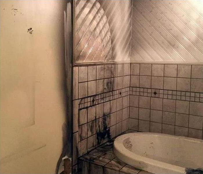 soot covered bathroom after a fire