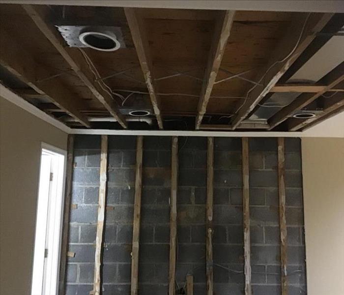 removed ceiling and wall panels from storm damage