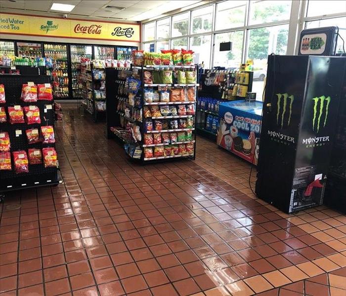 water on tiled convenience store floor