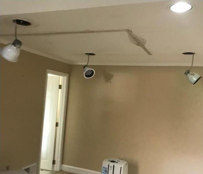 ceiling in a rec room with water damage